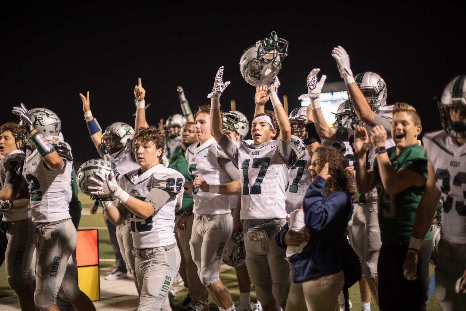 Seniors Cole Coughenour and Damian Patton celebrate after a touchdown against Lone Star, Nov. 3.