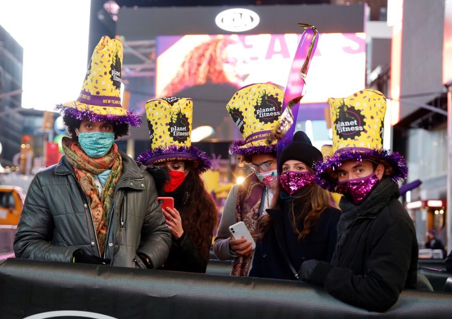 Revelers gather in their social distance pods in Times Square on New Years Eve in New York City, U.S., December 31, 2020. Gary Hershorn/Pool via REUTERS