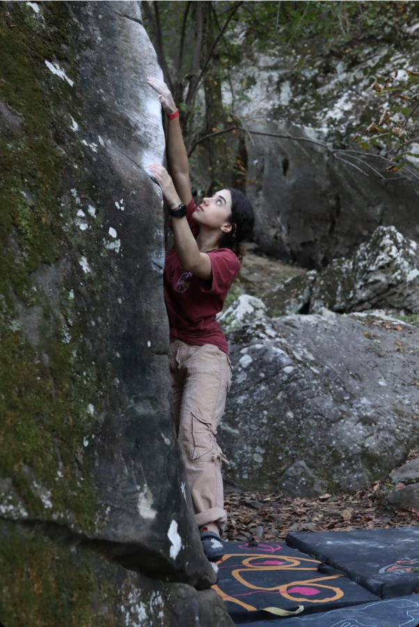 Photo credits to Laura Davila. Laura Davila practicing boulder climbing. 
