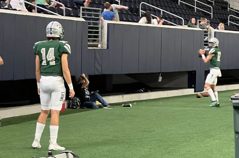 Branden Hernandez (14)  and Caleb Deal (12) practicing thier throws during half time in the Reedy v Lebanon Trail game.