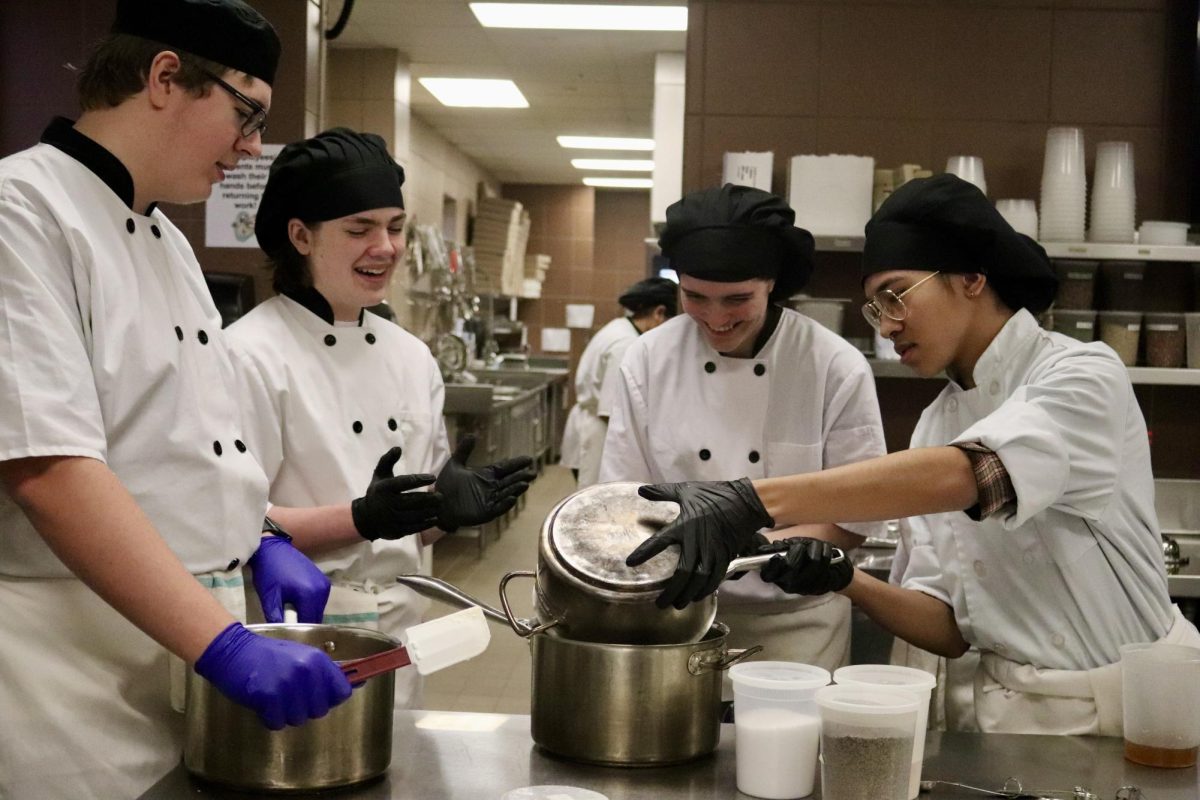 Culinary II students combine ingredients to make cookie dough. The food created by the culinary arts students is later sold at the CTEC bakery.