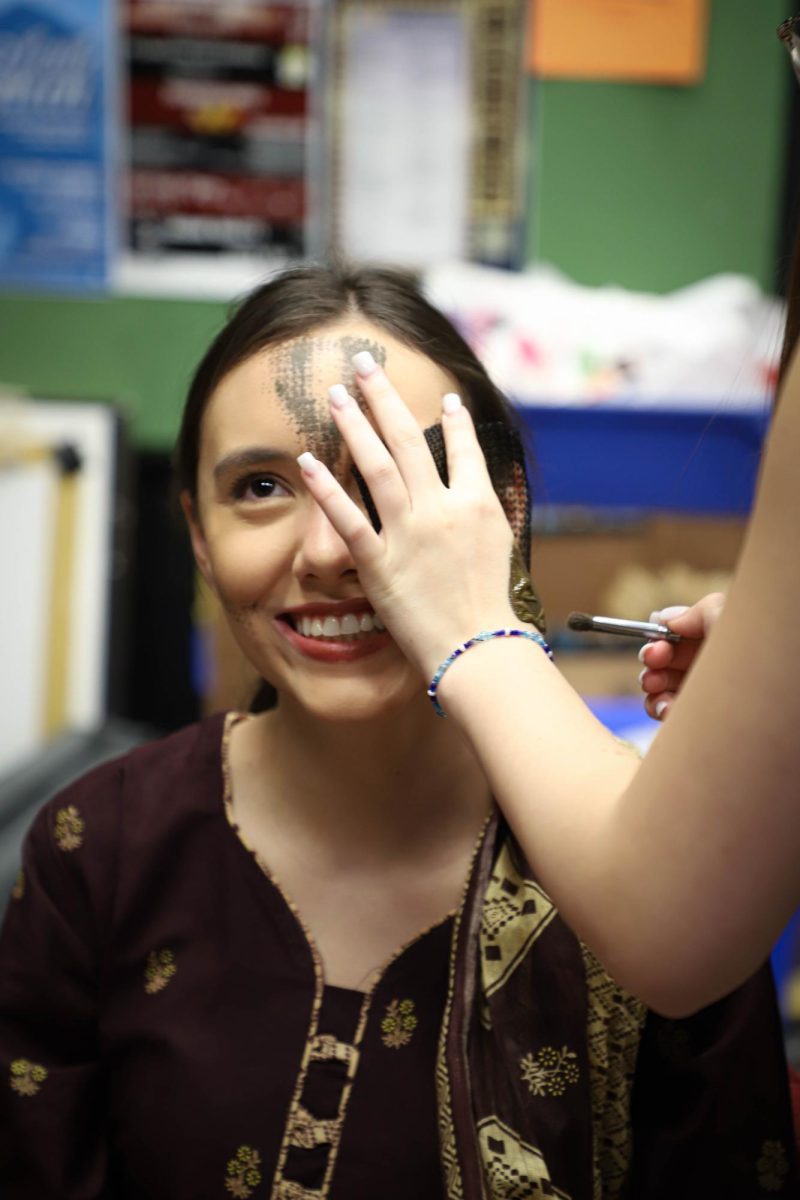 Isabella Herrera gets her makeup put on for the Jungle Book production. Herrera has been a part of theater for the last four years. 