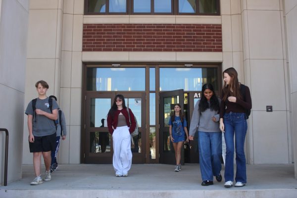 Six Reedy High School students leaving school. These and many other students got to leave an hour and a half ahead of time with early release.