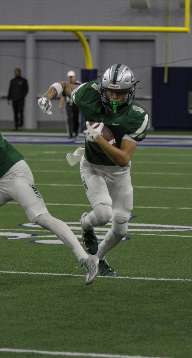  Senior Braylon Evans runs the ball for a touchdown. Evans has been a wide receiver on the varsity football team for the last three years. 