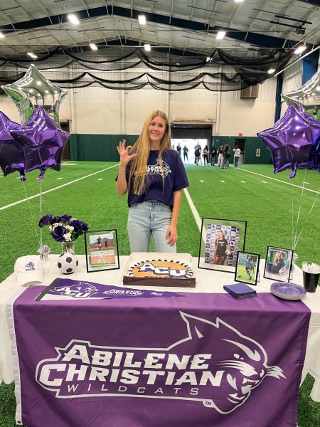 Emma Taylor posing with her table on signing day. Taylor is committed to play division one soccer at Abilene Christian University.